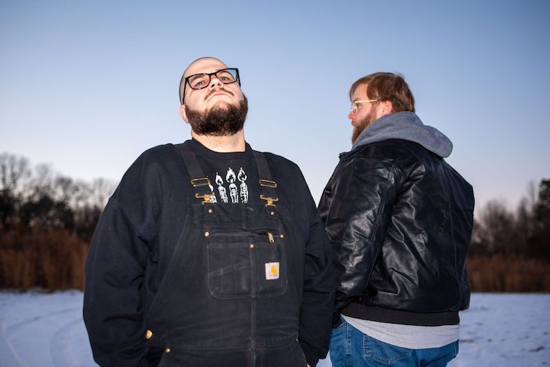 The band standing in a winter field