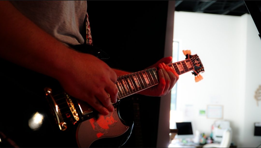 Close-up of Colton’s guitar